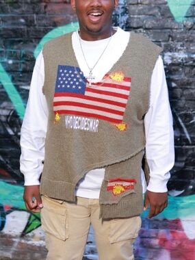 Green Who Decides War Sweater by MRDR BRVDO